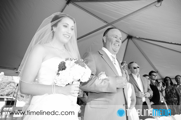 Wedding photography - Leah  and her dad walking down the aisle on her wedding day ©TimeLine Media