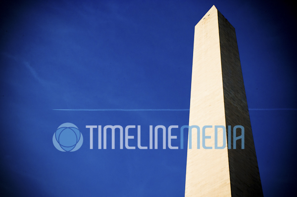 Contrail from plane passing over the Washington Monument ©TimeLine Media