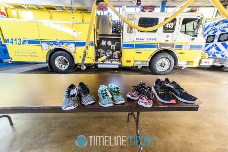 Shoes for donation and fire engine in Dunn Loring fire station ©TimeLine Media