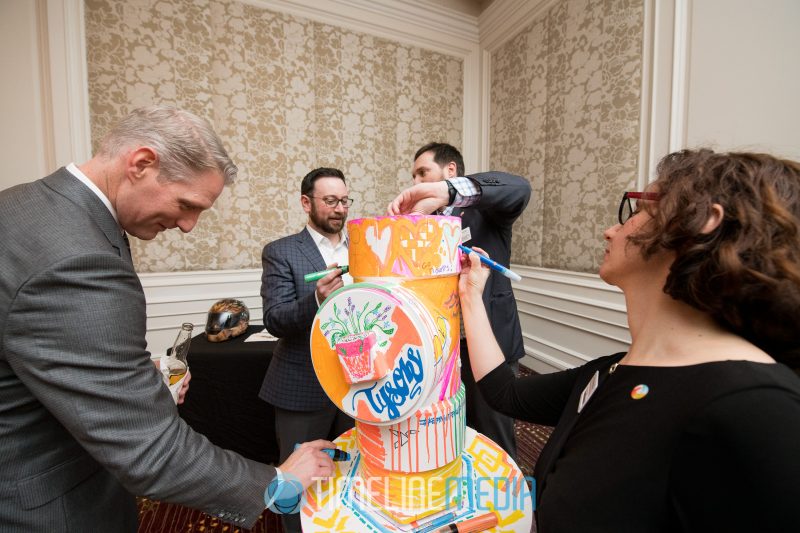 Artists and guests contributing to a Tysons Partnership art piece at the Ritz Carlton ©TimeLine Media