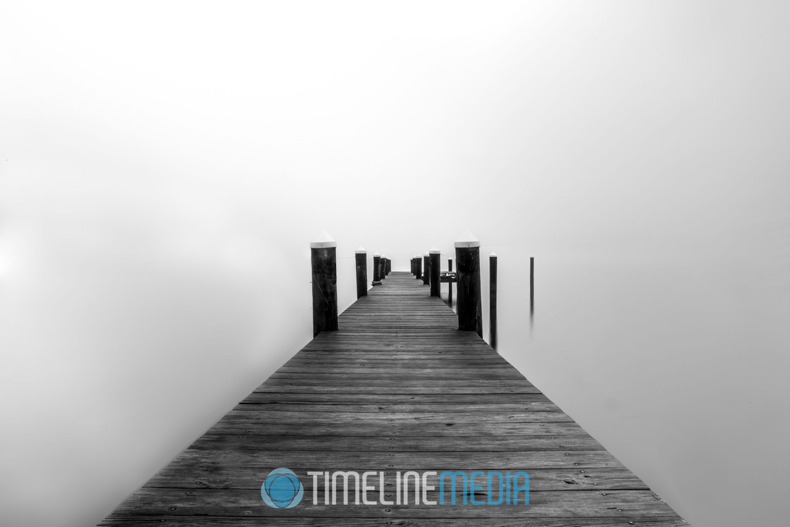 Pier under a cover of fog ©TimeLine Media