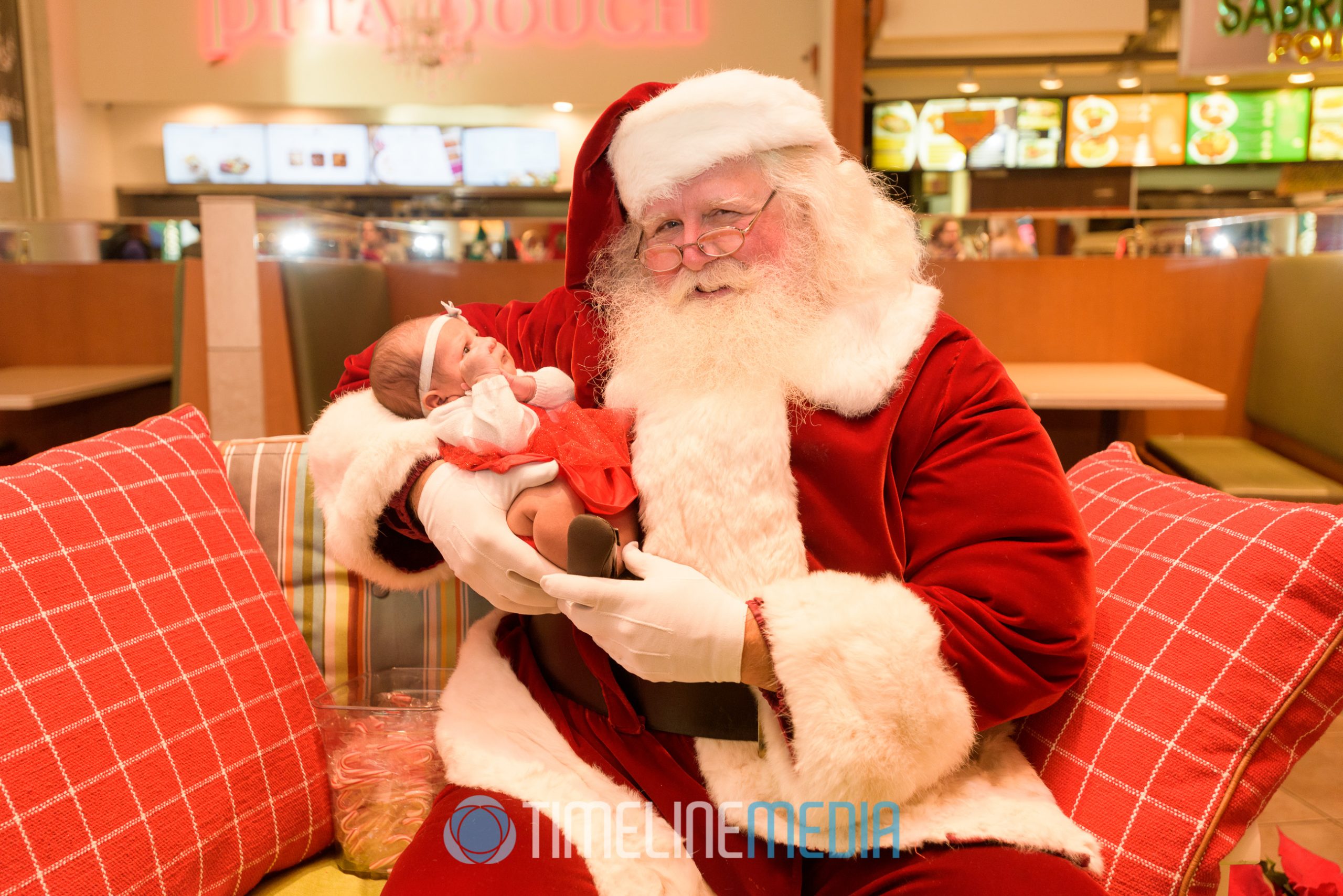 Santa Claus holding baby - Tysons Corner Center