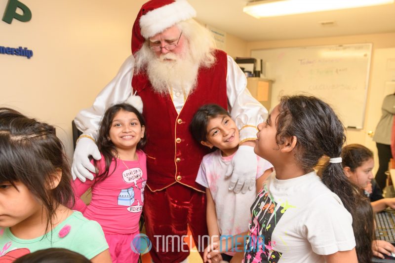 Santa greets children at their afterschool activity room