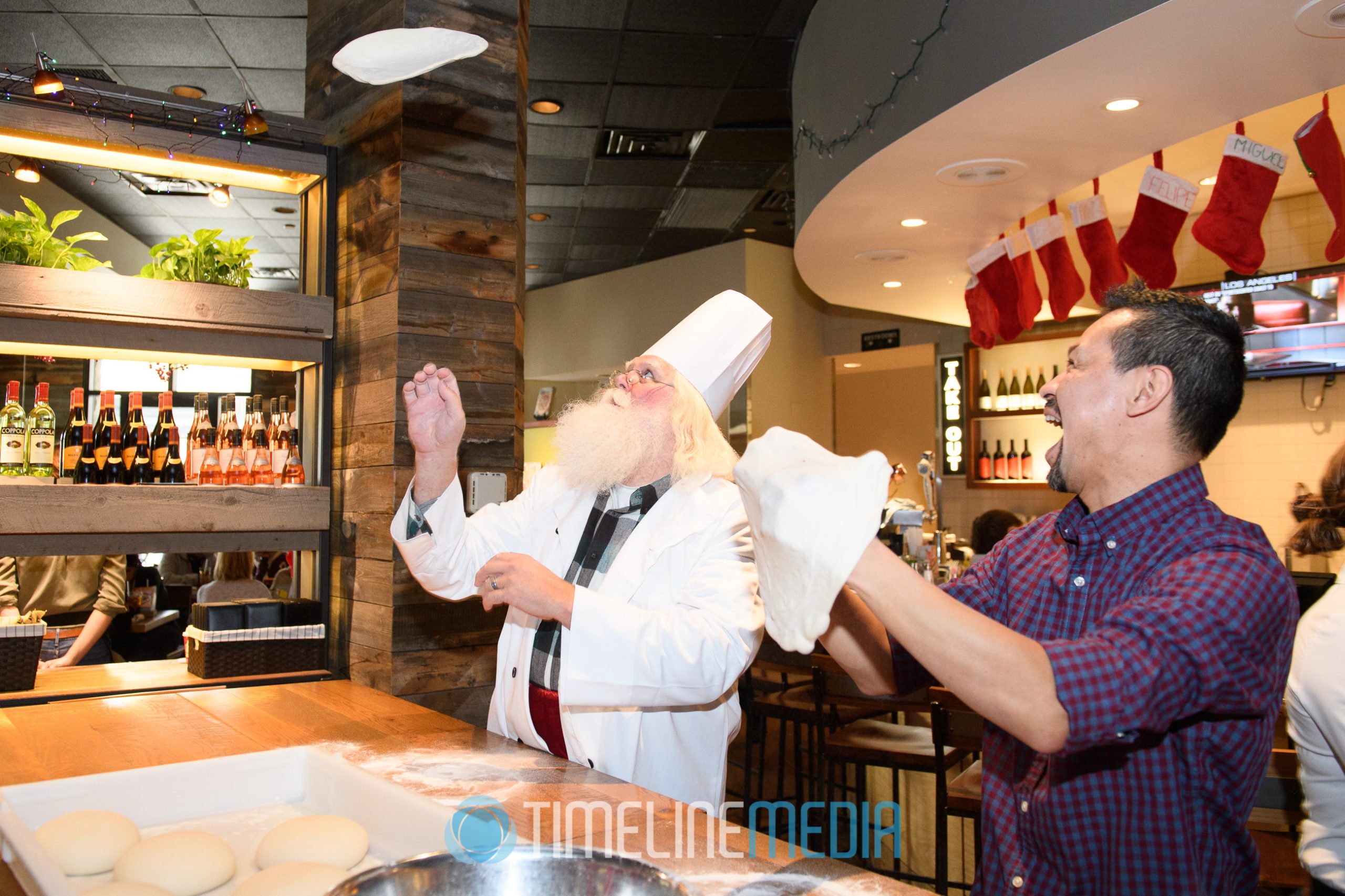 Santa tossing dough at California Pizza Kitchen 