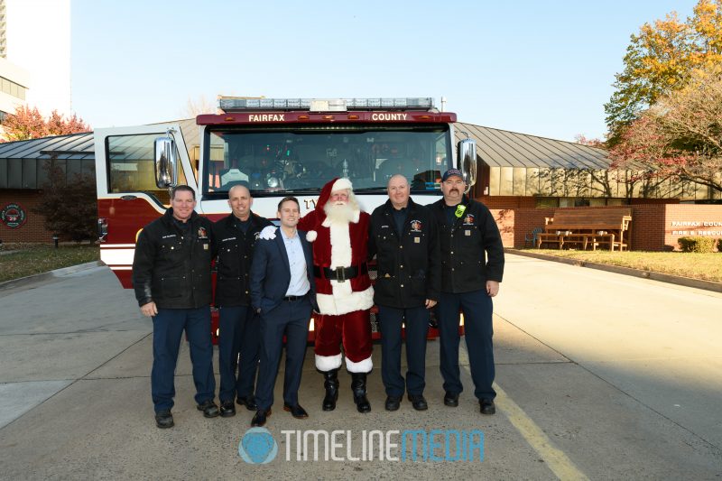 Firemen from Fairfax Fire Station 29 in Tysons with Santa before their ride to the mall