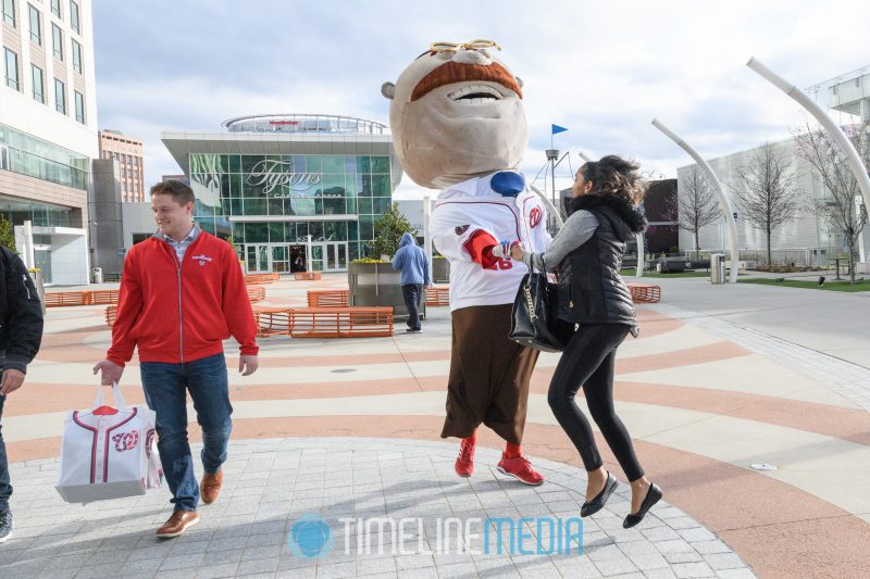 Racing President Teddy dancing with a fan on the Plaza at Tysons Corner Center