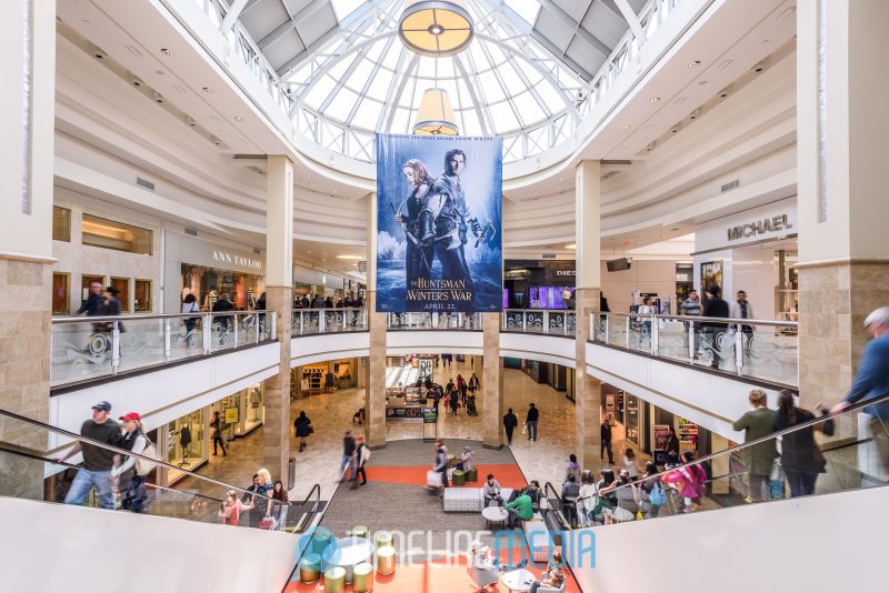 Large movie poster hanging in Fashion Court of Tysons Corner Center 2016 Shopping Center Media
