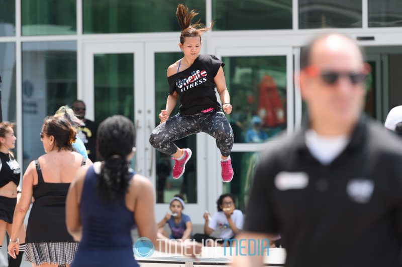 Exercise instructor jumping during the Zumbathon event on the Plaza ©TimeLine Media