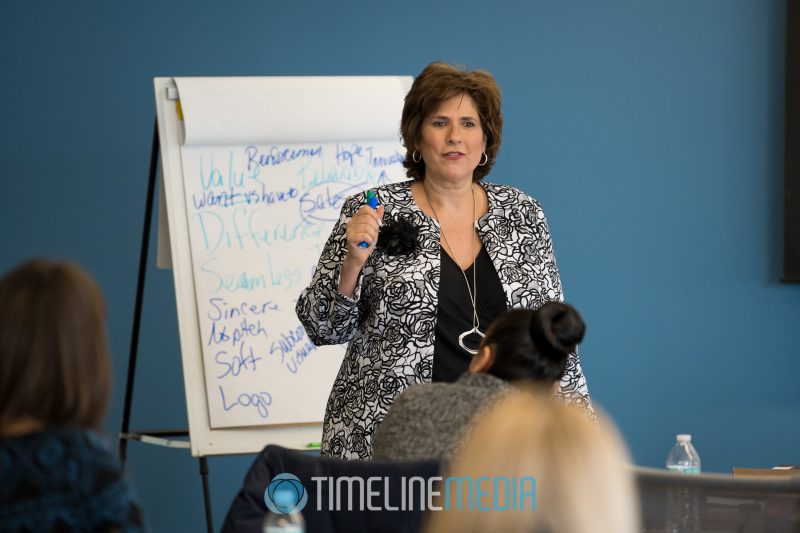 Photographing Laurie as she teaches a business coaching session in Washington, DC ©TimeLine Media