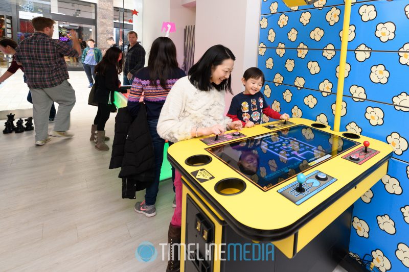 Playing video games at the SNAP! Entertaiment pop up at BrandBox in Tysons Corner Center