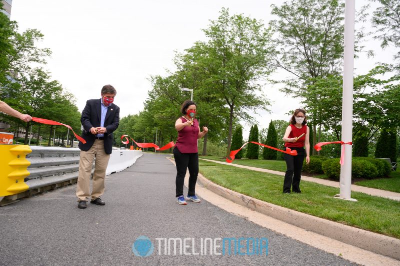 Supervisors Walter Alcorn, Dalia Palchik, and Tysons Partnership Roni Dancis cutting ribbon  ©TimeLIne Media