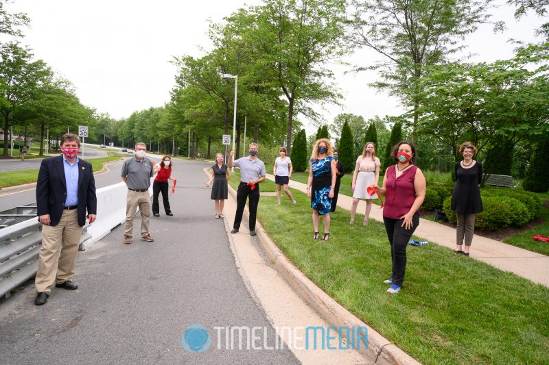 Group working on Open Streets projects at the ribbon cutting on Tysons Blvd. ©TimeLine Media