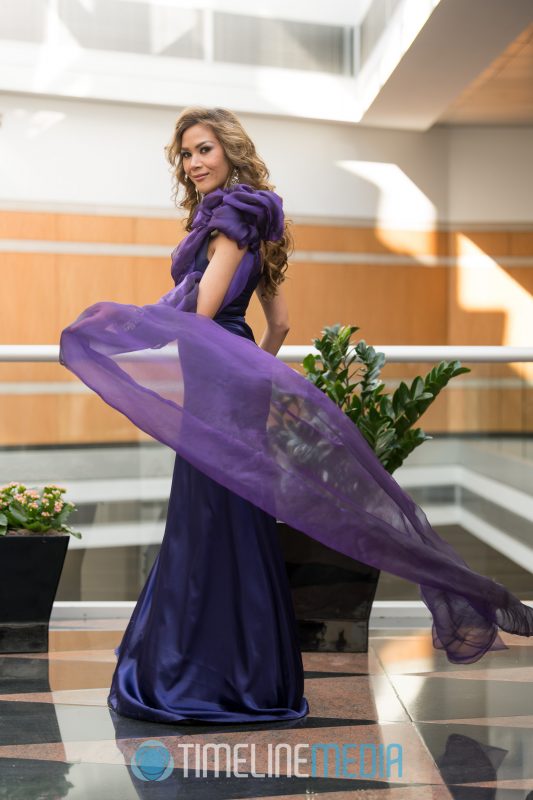 Modeling a purple gown with a little motion ©TimeLine Media Live TV Studio