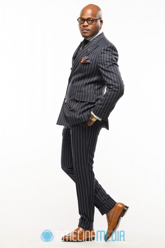 Striped suit modeling on a seamless white background ©TimeLine Media