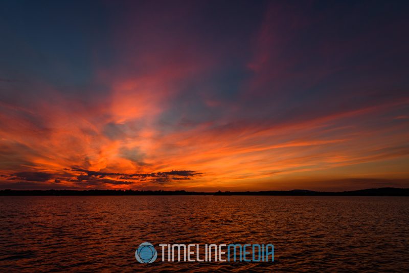 Clouds lit by the setting sun over Belmont Bay ©TimeLine Media