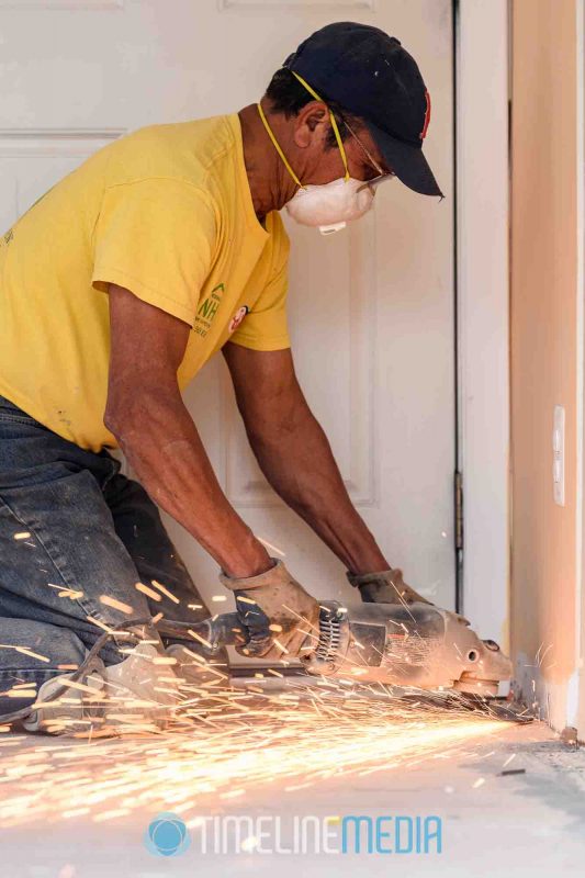 Noserale Home Improvement working on a sanding a floor with sparks ©TimeLine Media